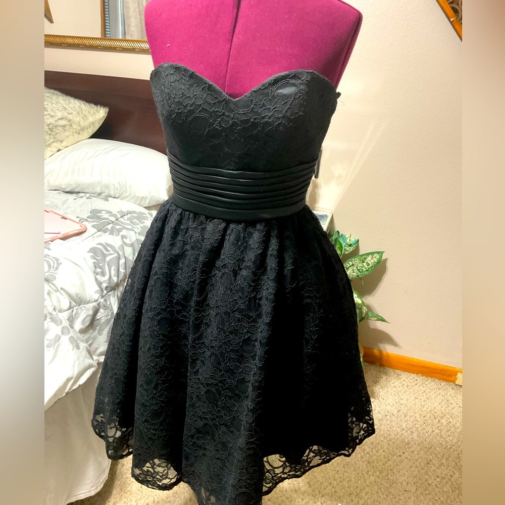 Beautiful designer party dress.  Little black dress